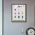 A chart of colors names and light and decorative elements hanging on the white wall.