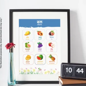 A chart of fruits names in Punjabi and English is on the table. Next to the chart, there is a red flower in a glass container and a clock placed on books.